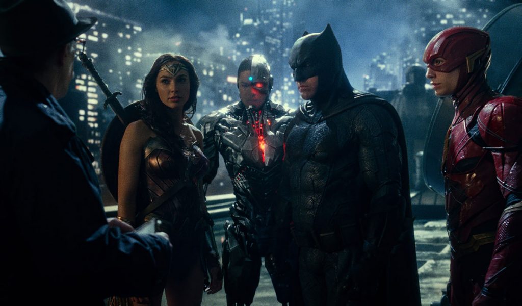 Left to right: J.K. Simmons, Gal Gardot, Ray Fisher, Ben Affleck, and Ezra Miller star in Justice League.